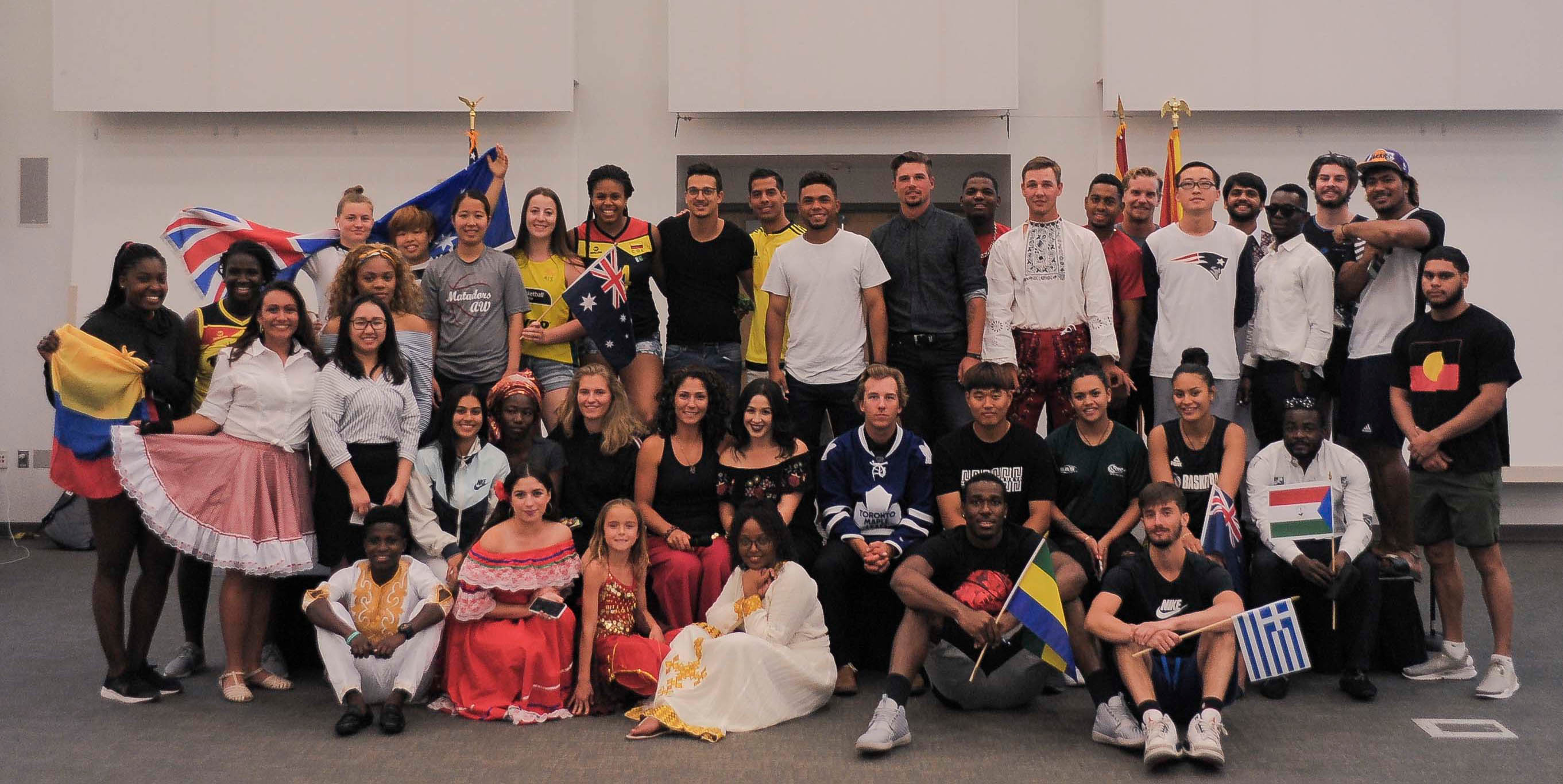 Large group of participants in various outfits from different cultures