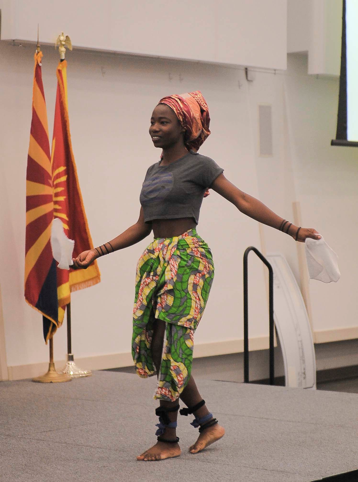 A student performs on stage