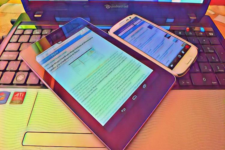 Colorful tablet and phone displayed on a laptop