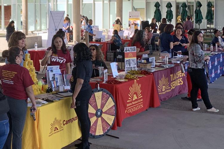 Exhibits were running in full swing at the Career and Majors Fair held on the Yuma Campus in November. Photo by Meghan McCullen Booths next to each other displaying different clubs