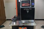 Water dispenser with orange and black colors and the text 